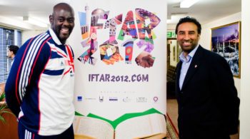London, UK - 21 July 2012: Team GB Olympic discus thrower Abdul Buhari poses for a picture with Shaukat Warraich, CEO and Founder of Faith Associates, during the Ramadan Iftar 2012 celebrations hosted at the Islamic Cultural Centre (ICC) in Regents Park.